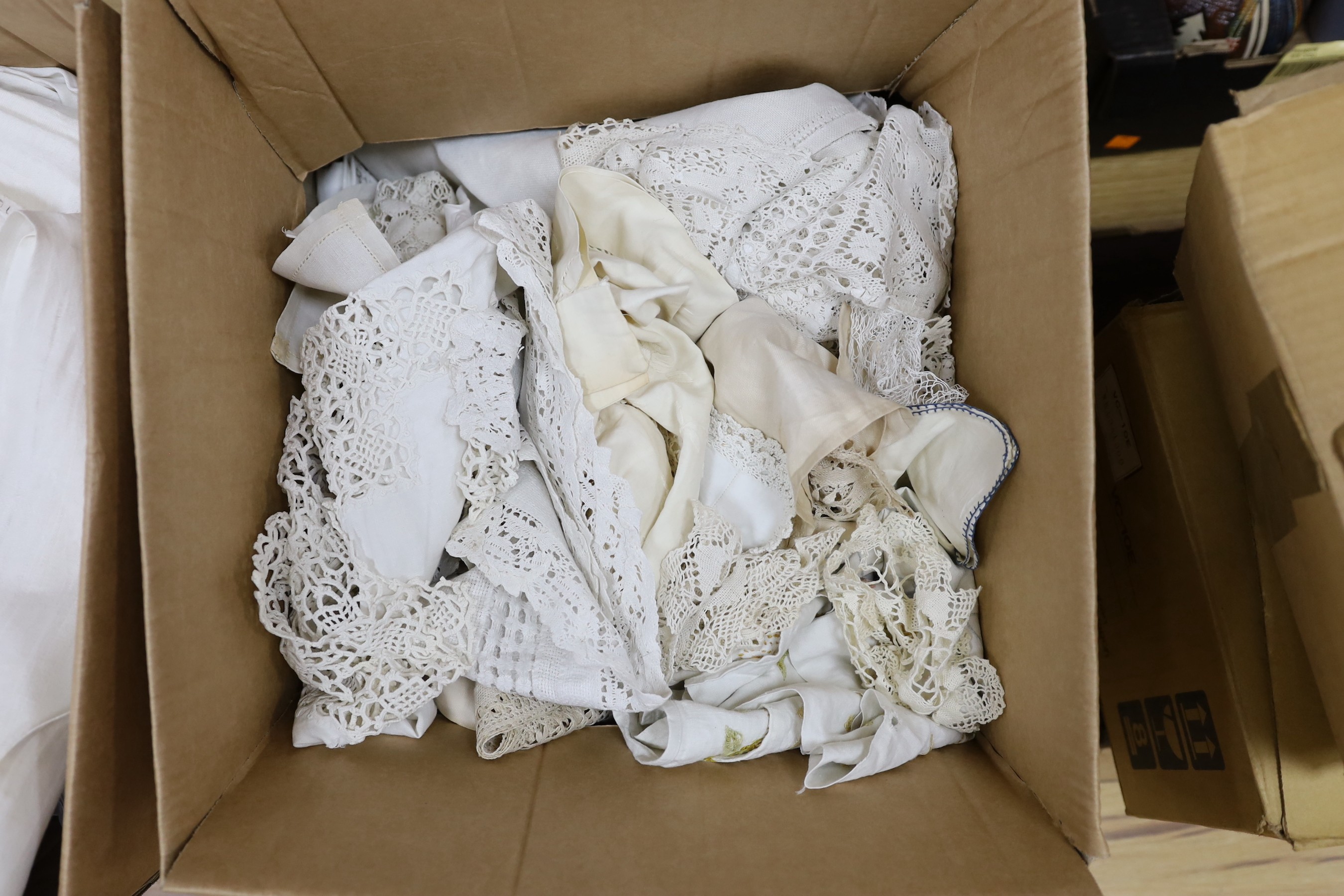 A 19th century Norwich shawl, together with mixed 20th century damask and crochet edged table cloths and linens